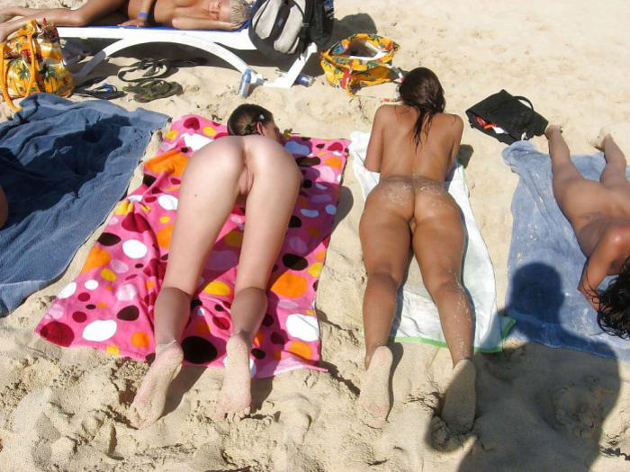Nudist swinger women at the beach Photo