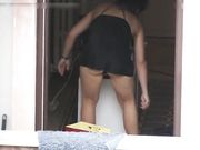 Upskirt hot MILF in short dress is filmed by the voyeur neighbor
