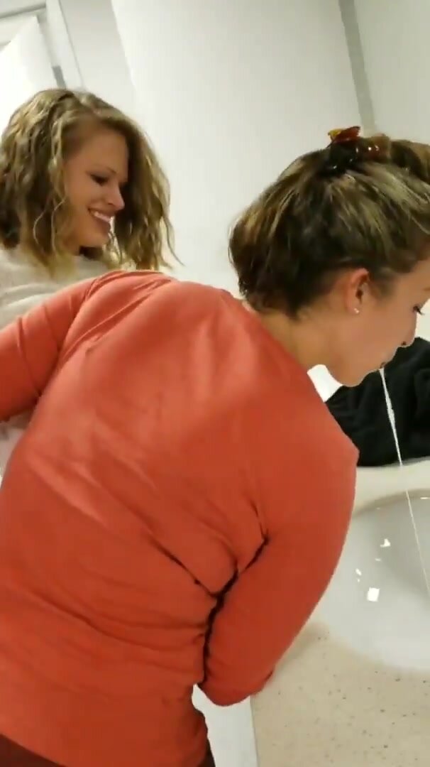 Wow so hot girl sucking lactating boobs of a girlfriend in public restroom pic