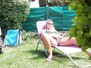 MILF masturbating in garden is surprised by partner and they have sexual intercourse